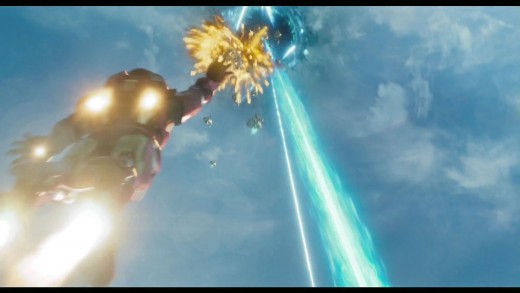 Iron Man in flight fighting alien forces as he heads to what looks like a rip in the sky