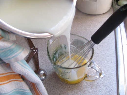tempering the egg yolks before adding to pudding mixture