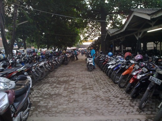 Bekasi commuters deposit their cars and motorcycles at  parking lots provided while they go to work in Jakarta by train.