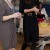 Black turtleneck and black slim skirt with a wide belt for a round of visits to various charities in February Black turtleneck and black slim skirt with a wide belt for a round of visits to various charities in February