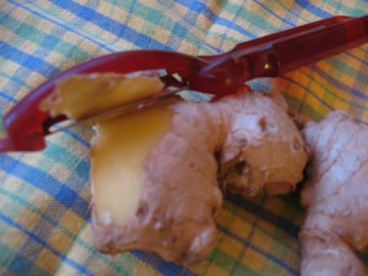 Peel fresh ginger by using a sharp peeler.