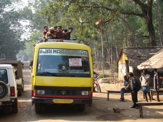 Pilgrims come in hoards , some taking the dangerous route of traveling on the roof of Buses.