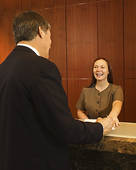 SEE THE SMILING FRONT DESK CLERK? A SMILE GOES A LONG WAY WITH ANY ROAD-WEARY TRAVELER.