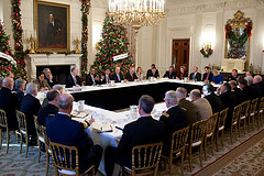 President Obama meets with his Cabinet and Special Advisors to discuss an important issue that will affect us, the citizens of the United States. I don't see any coffee on this table.