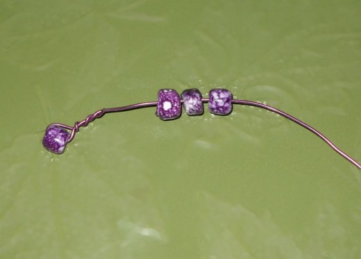 twist wire closed around one bead