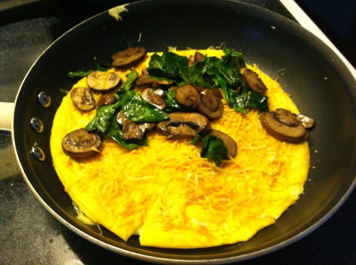 Add desired fillings & cheese. This photo has sauteed spinach & mushrooms with a Mexican shredded blend cheese