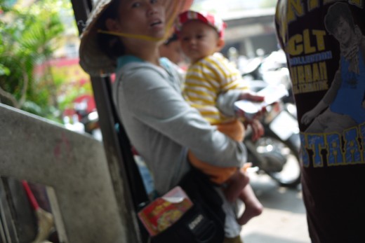 A quick snapshot. I meant to focus on the woman and child. This photo is interesting to me.
