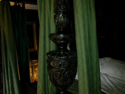 Ornate carving on the bed posts 