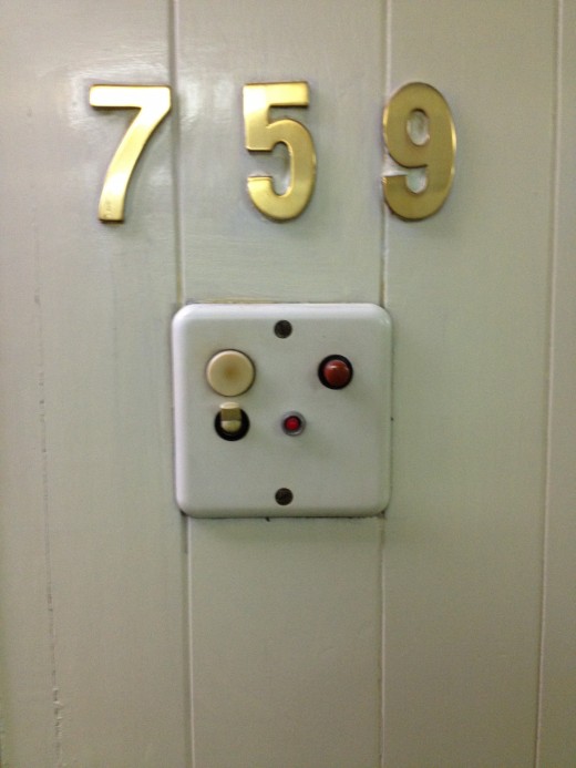 Can anyone tell me what these buttons are outside of my room?
