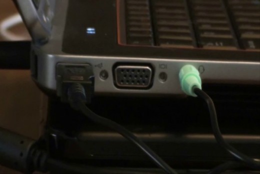 Plug the 1/8-inch green audio cable in to the headphone jack on the computer, the 1/8-inch pink audio cable in to the mic jack and the USB connector to an available USB port.