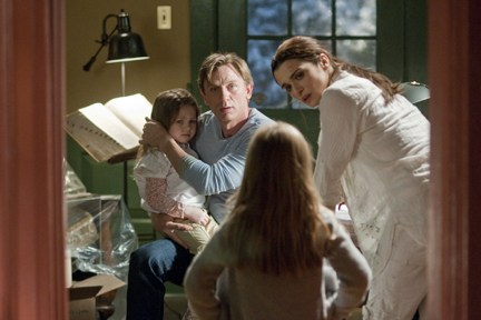 Craig and Weisz have a family moment in "Dream House."