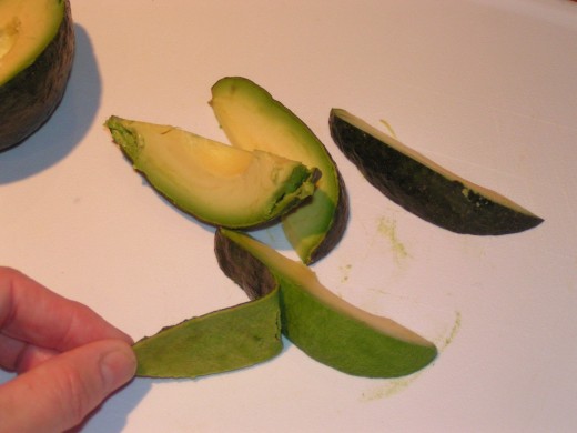 This image demonstrates an easy way to peel an avocado.