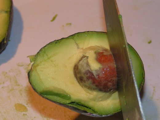 Whack avocado seed/pit with knife.