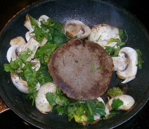 Mouth-watering turkey burger cooking up with mushrooms and cilantro. And I never leave out the garlic!