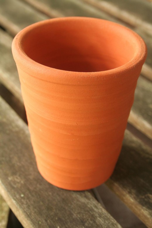How does crazing affect the value of pottery?