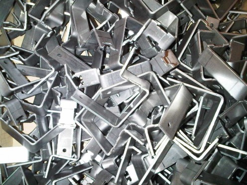 3mm thick mild steel brackets.  These ones are used to hold up light fittings on track systems for exhibition stand lighting.