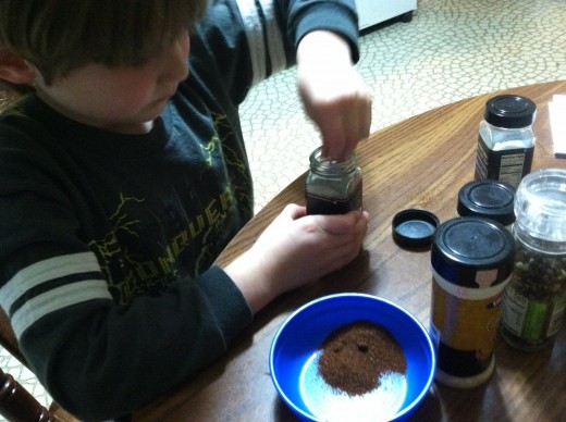 My 6 year old helps by measuring and combining spices to make homemade taco seasoning