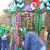 Vendor selling Mardi Gras style beads, hats and head pieces in St. Patrick's Day colors. 