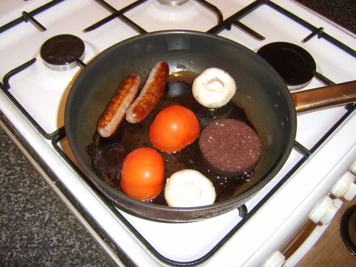 The sausages, black pudding, tomato and mushrooms are all fried in the same pan