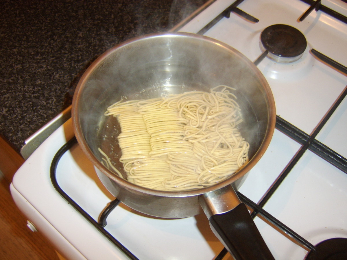 Dried noodles are added to boiling water to rehydrate