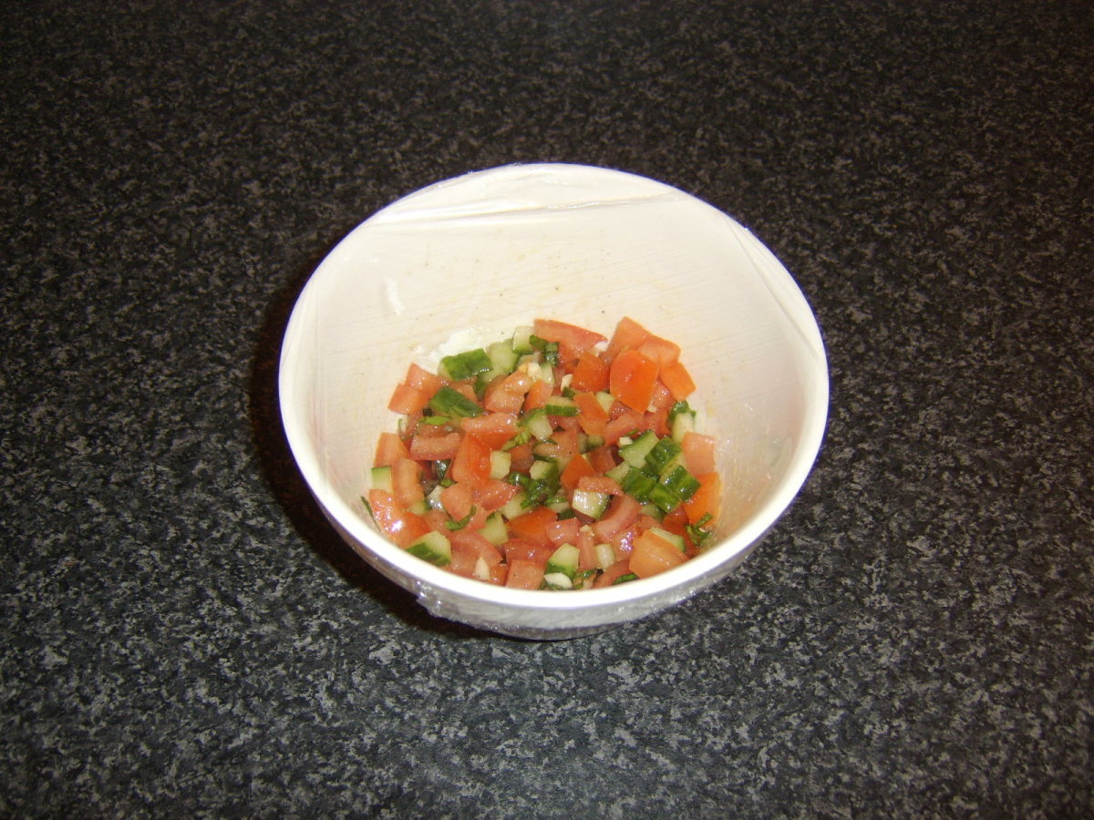 Salsa is covered with plastic wrap and refrigerated until required