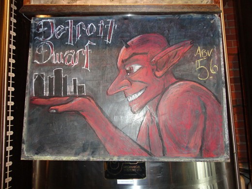 Representation of "Le Nain Rouge", or "The Red Dwarf", the mythical figure that haunts Detroit and is cause. Wikimedia Commons Attribution