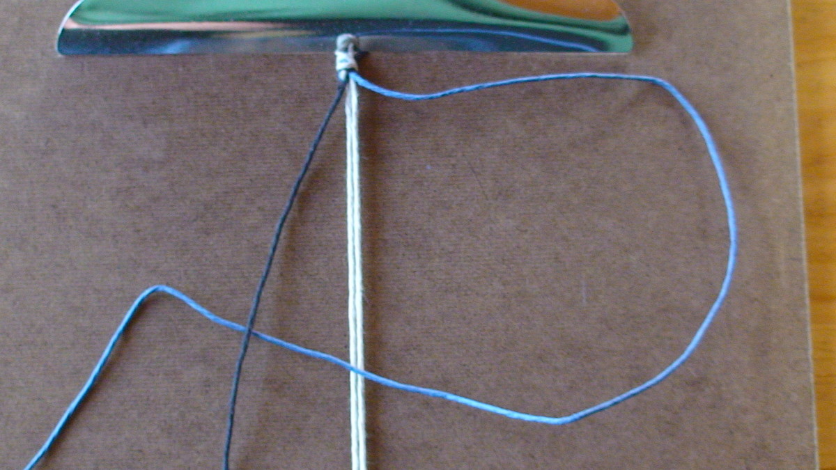 Step 4  Left cord (black) is overtop of right cord (blue.