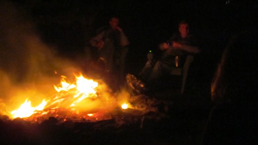 My neighbors gather around the camp fire, discussing various issues. 