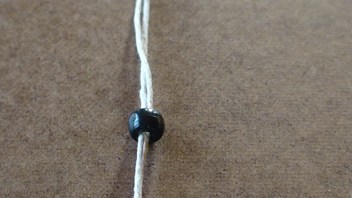 Step 1-2  String large bead on two anchor cords.