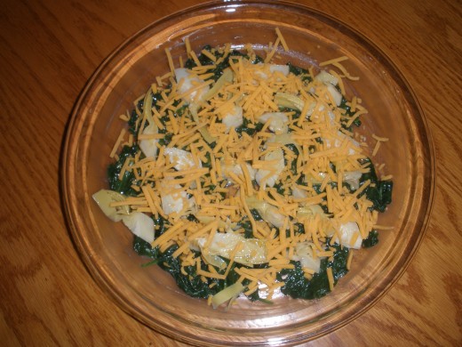 Sharp cheddar on top of the artichoke hearts and spinach. 