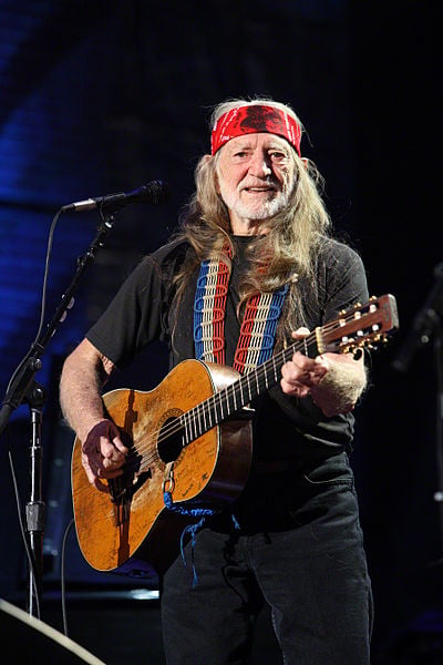 Willie Nelson performing at Farm Aid in 2009, one of the many charitable causes he has been involved in over the years.