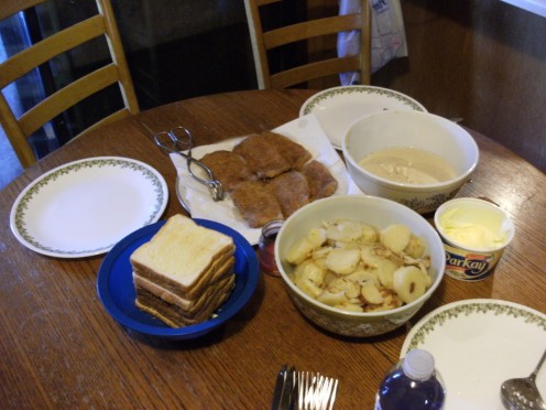 The complete set up Deep fried Pork Chops, Skillet Potatoes, Home made gravy,and Toast.