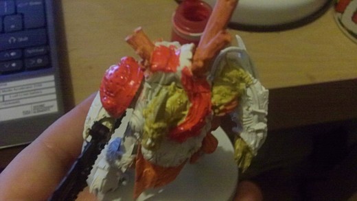 Red gore paint for the should pad and torso section of armor.