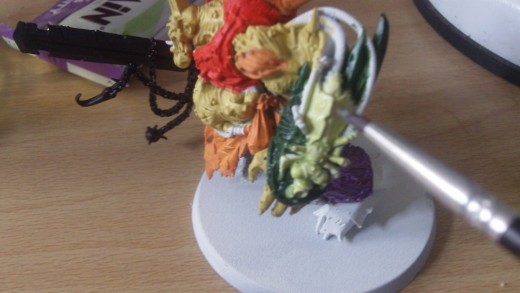 Bilious green which is a lighter green for the rotting fly nurgle symbol on the arm.
