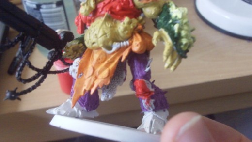 Then paint the knee armor pads in red gore too or acrylic paint.