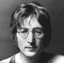 JOHN LENNON LOOKING DEPRESSED. GUESS WEARING FAKE EYEGLASSES CAN DO THAT TO EVEN THE MOST CREATIVE MUSICAL GENIUS, HUH?