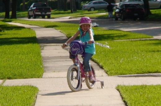 Younger kids riding on sidewalks should also be aware of pedestrians and other children playing in their yards.