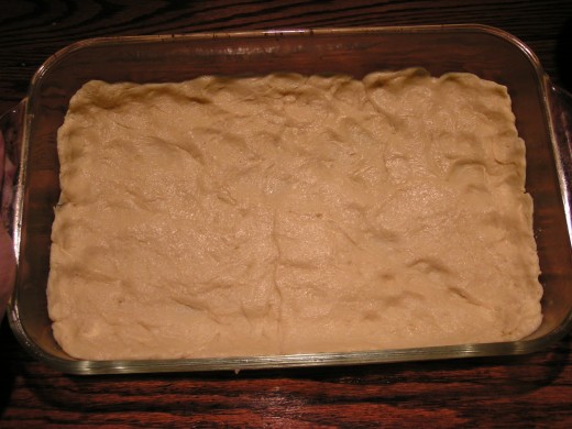 Press crescent rolls into baking dish.