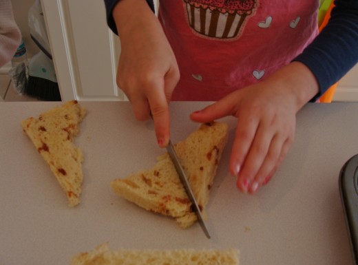 Cut the sliced bread into smaller pieces.