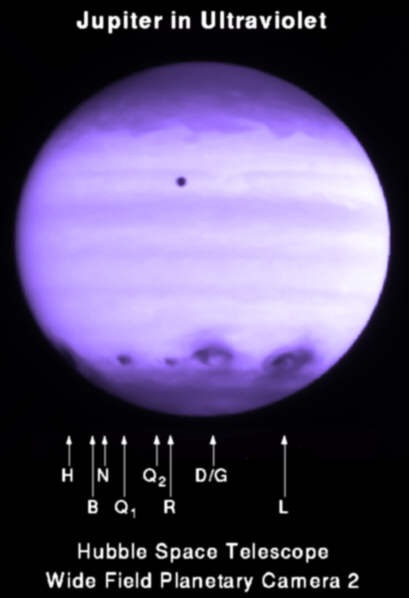 This is what Jupiter looked like in ultraviolet after a fragmented comet, Shoemaker-Levy 9, slammed into it in 1994. Many of those scars are larger than Earth. This is why blowing up an asteroid may not be the best approach.