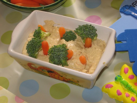 It's all in the presentation...this hummus dip vanished quickly when presented as a carrot patch, with broccoli-topped carrot sticks peeking out of the dip.
