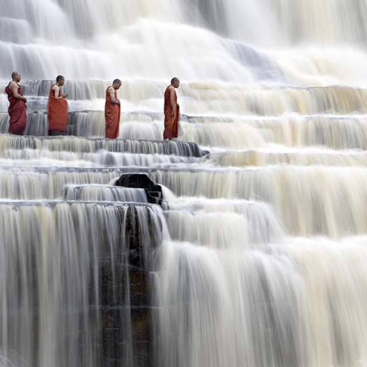 Buddhist monks at Pongua Falls, Vietnam.