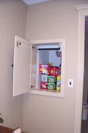 This shows a residential dumbwaiter loaded with some groceries.