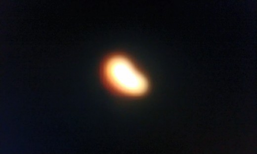 A close-up zoom-in of the UFO