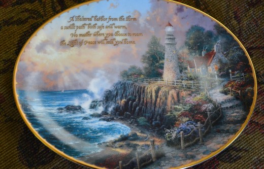 Please forgive the glare in the photo.  Even though I turned off the flash, the curve of the plate caught the light from outside and caused glare.  You can get an idea of his beautiful work, I hope.  