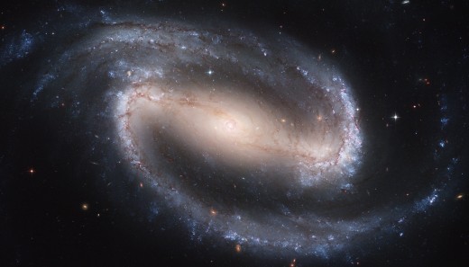 I loved drawing barred galaxies when I was a kid: a half spiral, a bar, and another half spiral, like an intergalactic belt buckle. Thanks to Hubble, we can finally get a better idea what we're seeing.