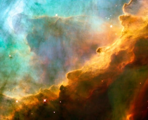 Glowing hydrogen gas and other elements in a massive nebula, the exploded remnants of an ancient star coalescing into new stars and solar systems. 