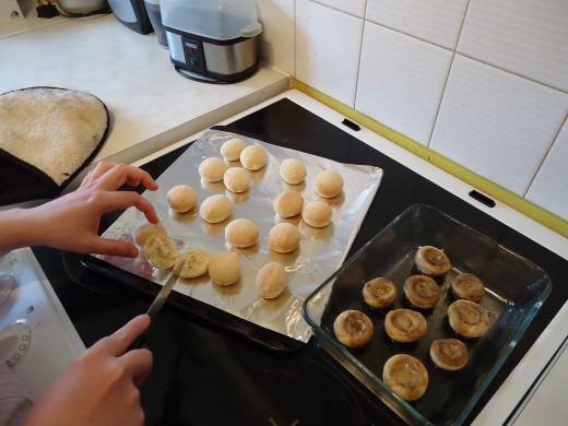 Slicing the dough balls.  Be careful- they're hot!