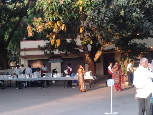 As the first rays of light catch the large mango tree, in front of the parsonage, breakfast is being laid out for the congregation.