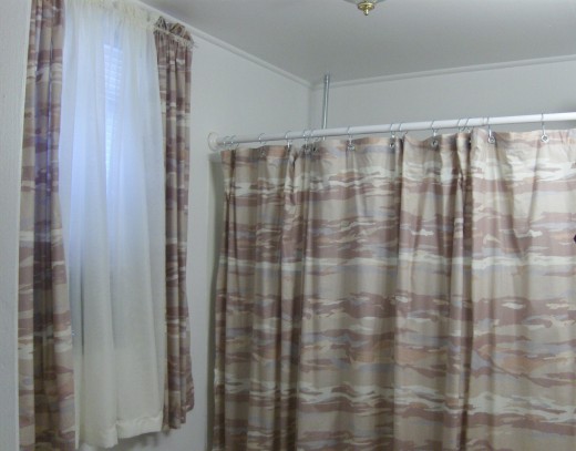 Simple Rod pockets on window with sheer in between and the shower curtain made the same way, but grommets are put in where the rod pocket would be.